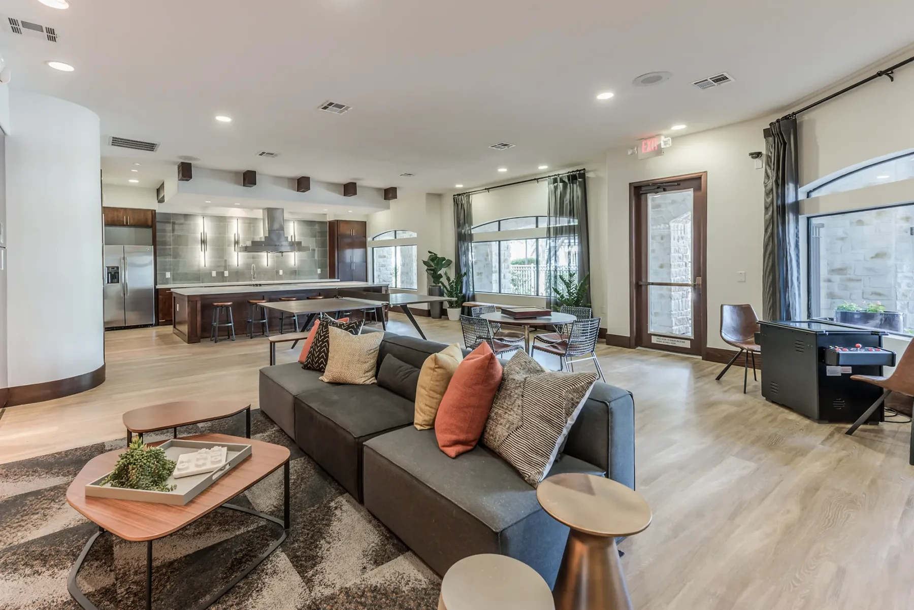 Clubhouse demonstration kitchen, ping pong table, and lounge seating