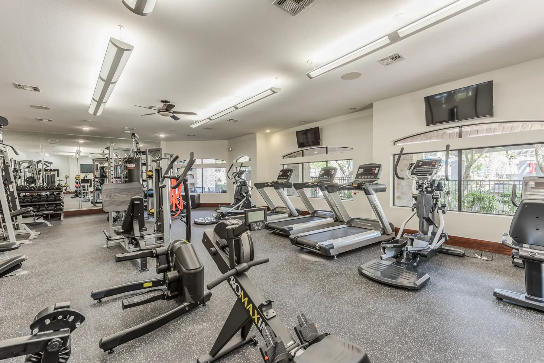 Fitness center with cardio and strength training equipment