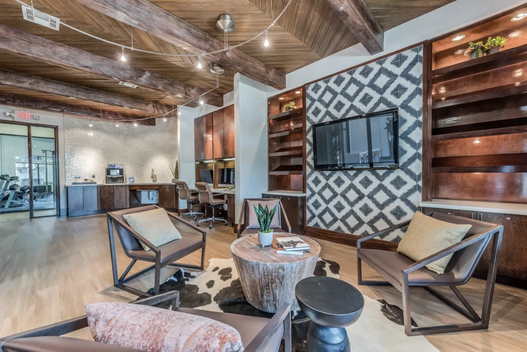 Clubhouse with lounge seating and computer stations and coffee bar